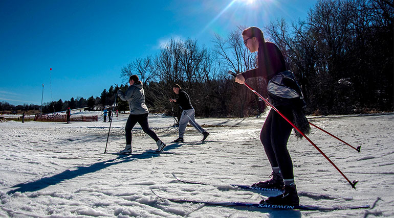 People cross-country skiing in the snow